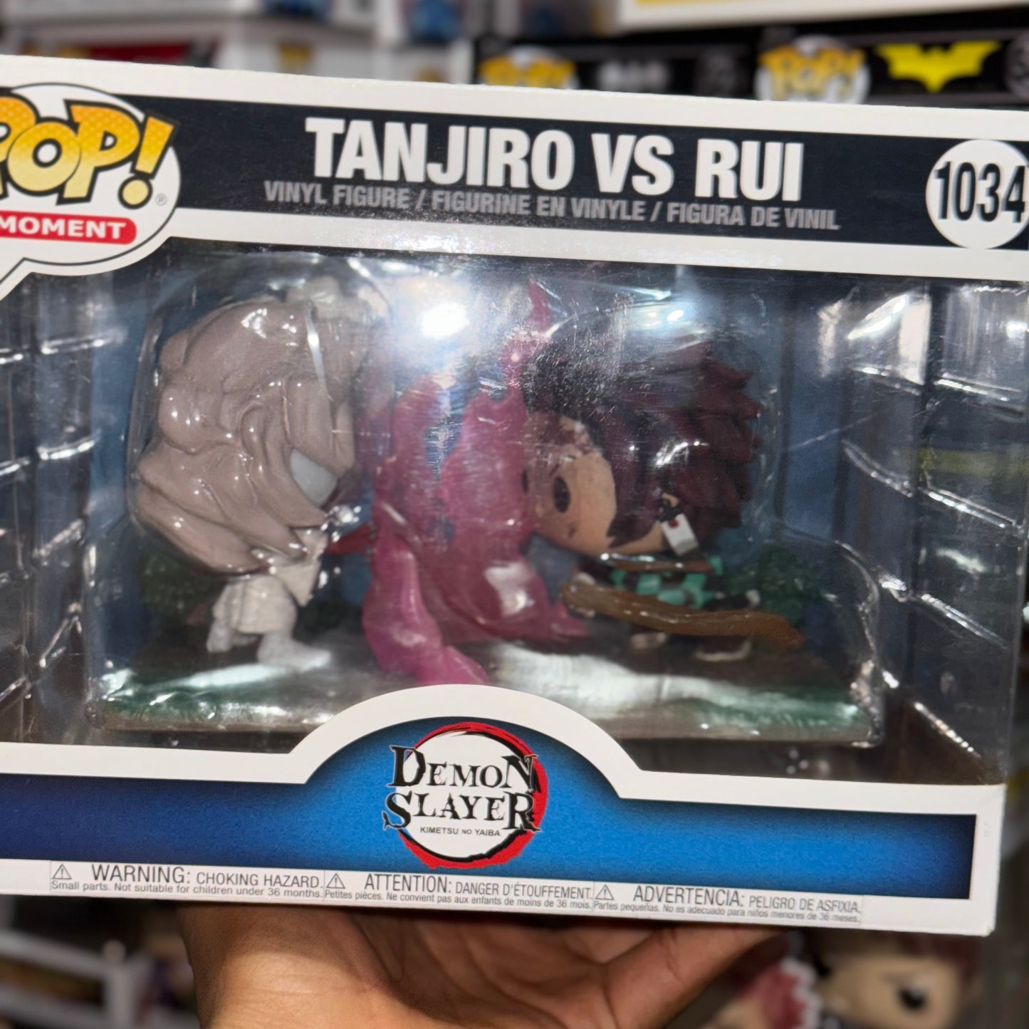 Demon Slayer - Tanjiro Vs Rui Pop Moment detalle en plastico de la caja